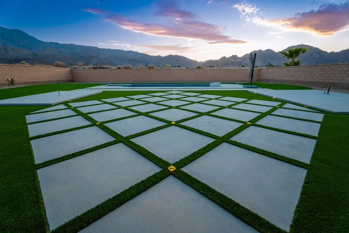 Patio at dusk with landscape lighting