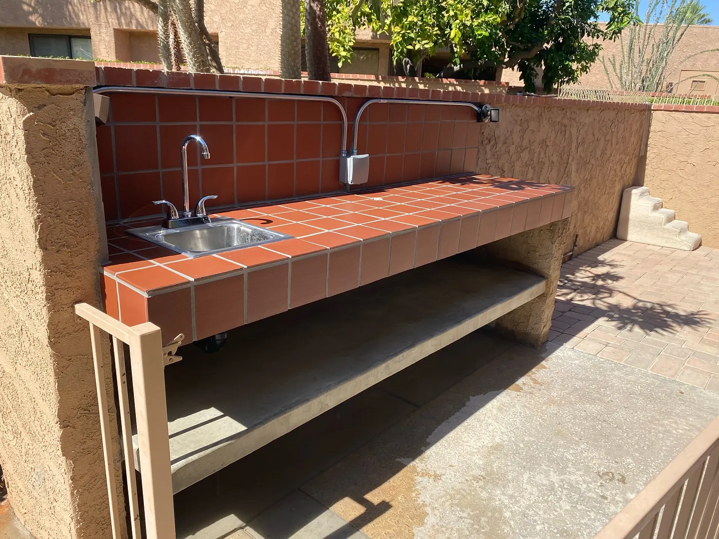 Brick outdoor BBQ island with sink
